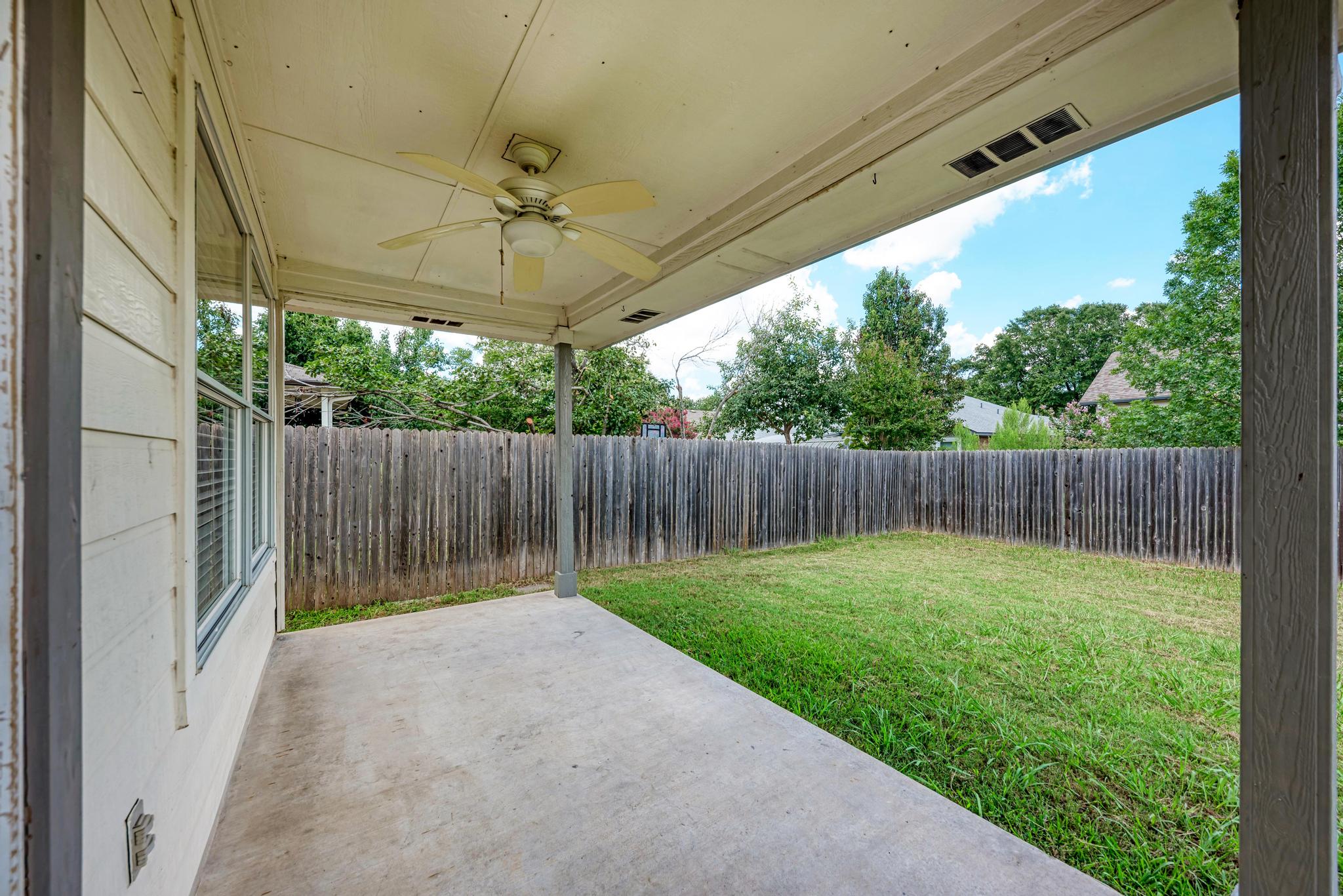 4408 Tello Path Austin, TX 78749 - Photo 32 of 38 Fenced backyard featuring a patio area and a ceiling fan