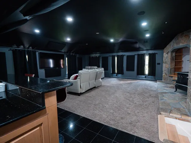 a kitchen with stainless steel appliances granite countertop sink stove and cabinets