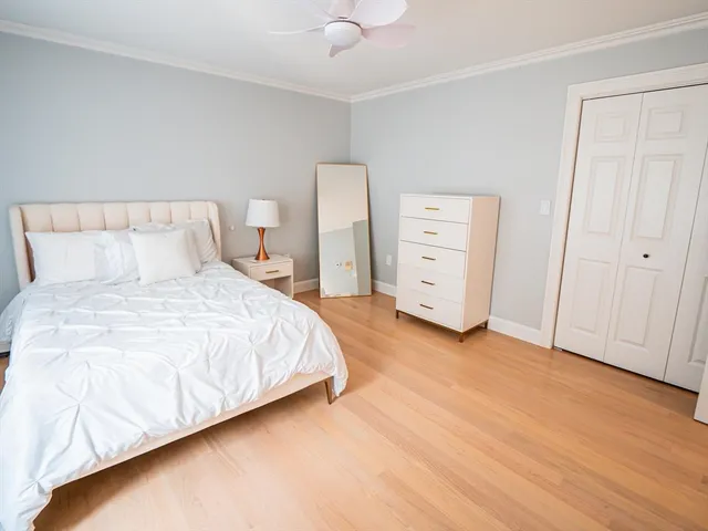 a bedroom with a bed and a walk in closet