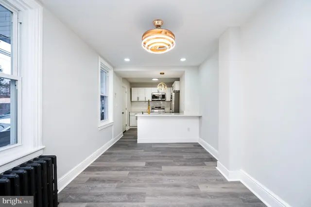 a view of a kitchen with a sink and a window