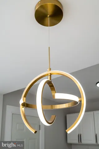 a kitchen with a refrigerator a sink dishwasher and a stove with wooden floor