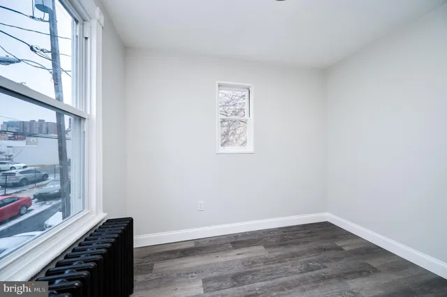 a kitchen with cabinets stainless steel appliances and a counter space