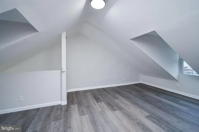 a white toilet sitting next to a bath tub