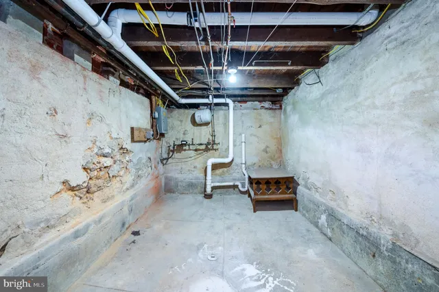 a view of a house with a wooden fence