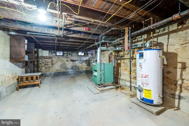 a view of a house with a wooden fence