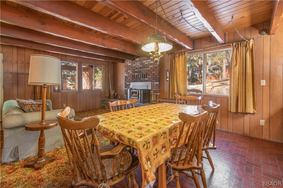 458 Edgemoor Road Big Bear Lake, CA 92315 - Photo 13 of 47 a view of a dining room with furniture window and wooden floor