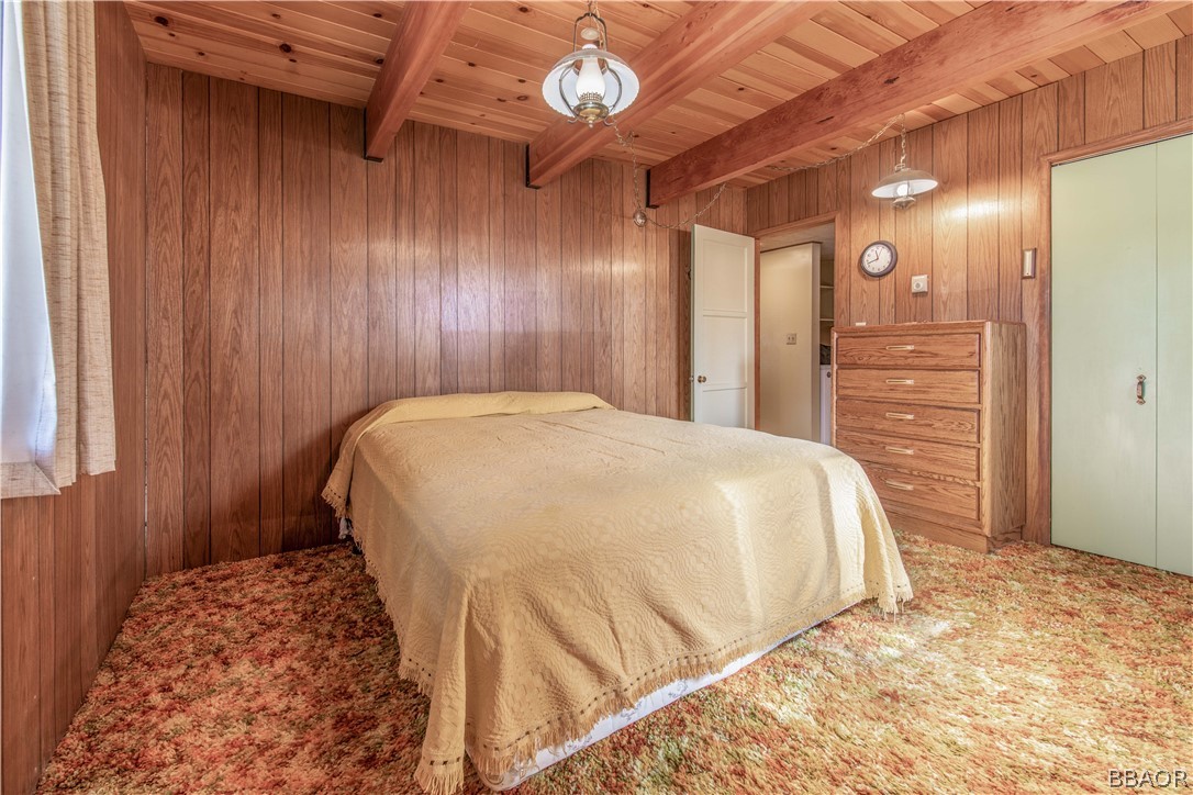 458 Edgemoor Road Big Bear Lake, CA 92315 - Photo 23 of 47 a spacious bedroom with a bed and a cabinets