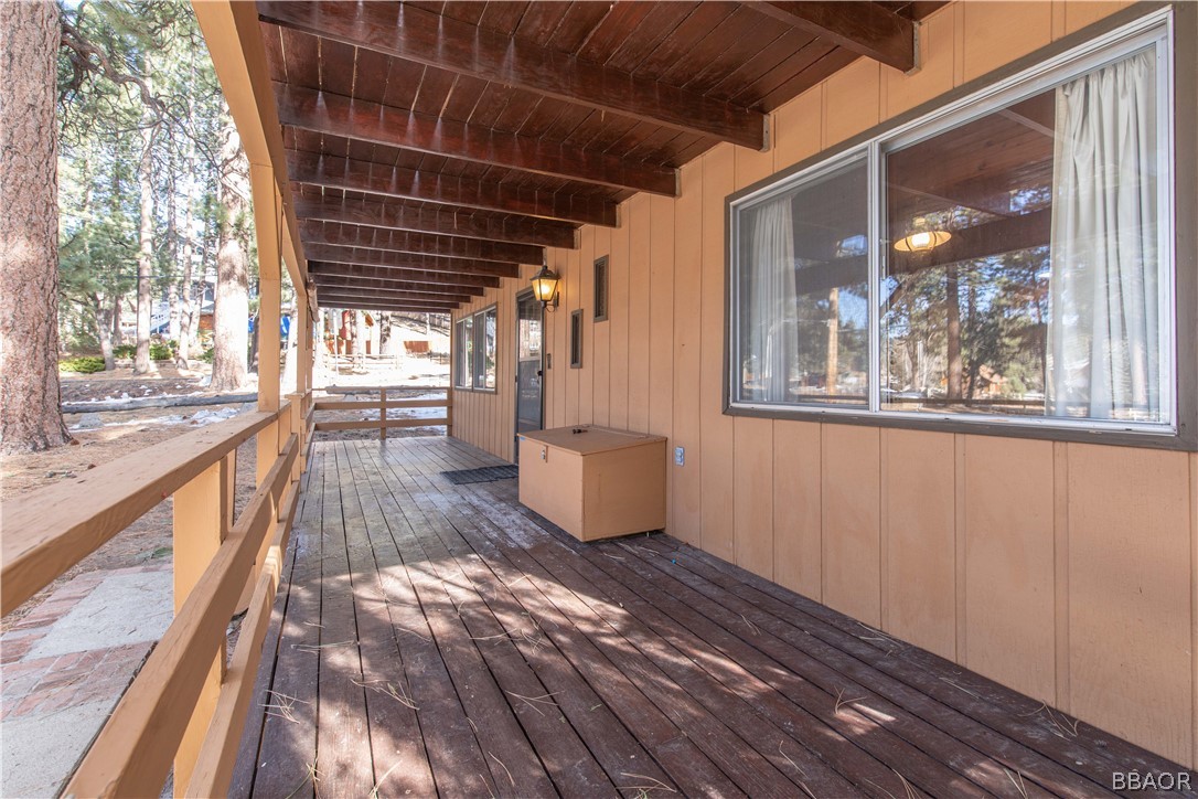 458 Edgemoor Road Big Bear Lake, CA 92315 - Photo 6 of 47 a view of a porch with wooden floor and city view
