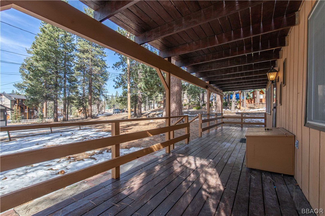458 Edgemoor Road Big Bear Lake, CA 92315 - Photo 8 of 47 a view of a porch with furniture and wooden floor