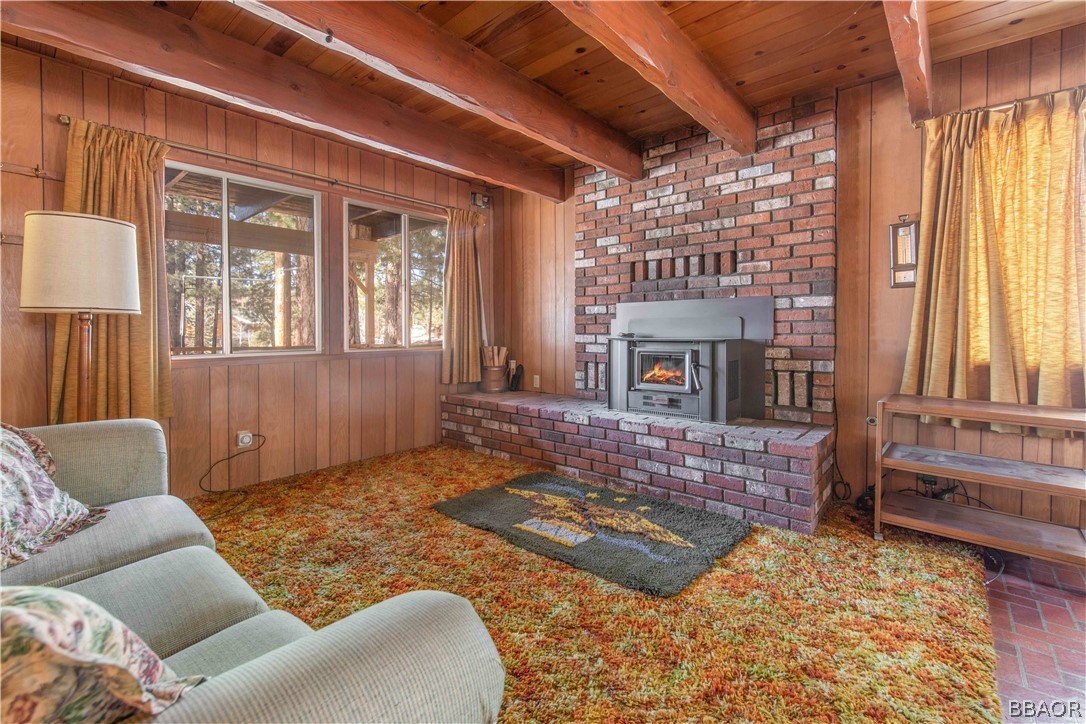 458 Edgemoor Road Big Bear Lake, CA 92315 - Photo 9 of 47 a living room with furniture windows and a fireplace