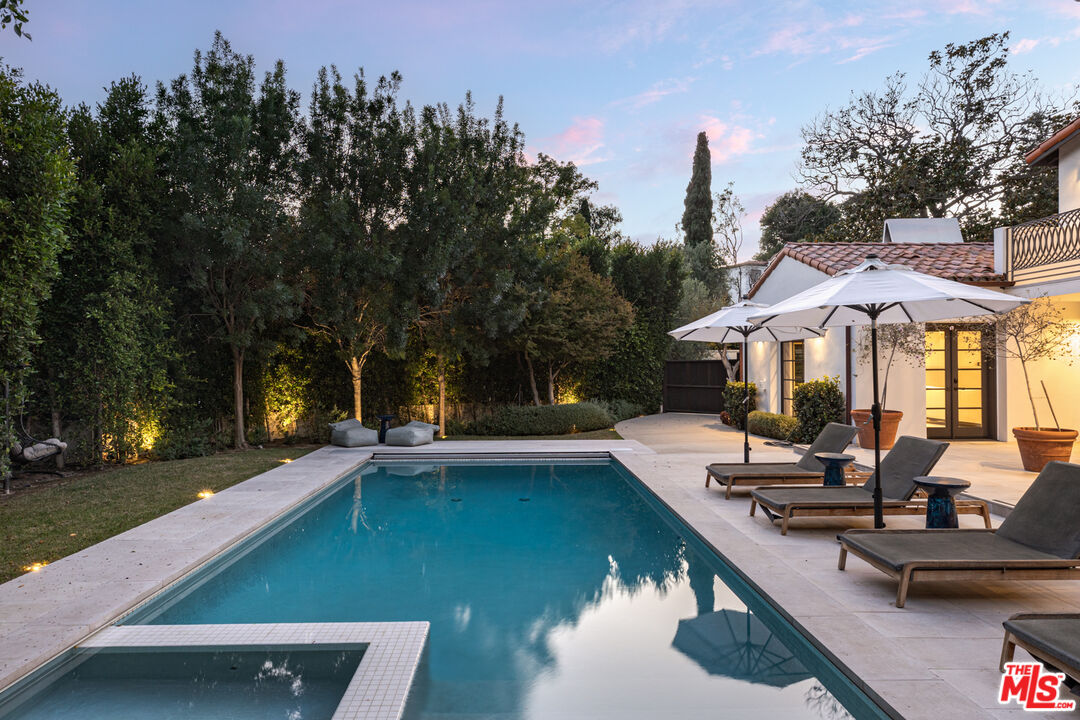 1118 Tower Road Beverly Hills, CA 90210 - Photo 14 of 16 a view of a house with swimming pool and sitting area