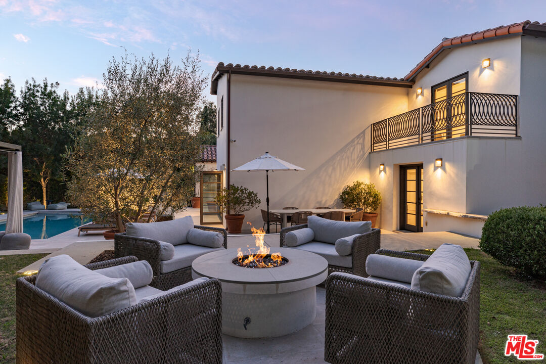 1118 Tower Road Beverly Hills, CA 90210 - Photo 15 of 16 a outdoor living space with furniture and a fireplace