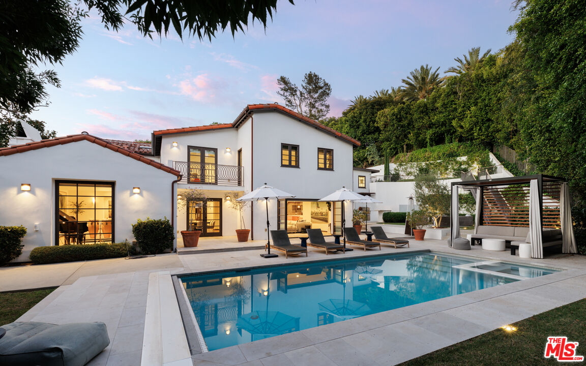 1118 Tower Road Beverly Hills, CA 90210 - Photo 2 of 16 a view of a house with a swimming pool