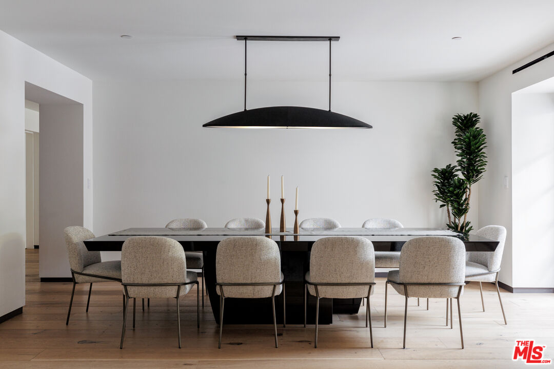 1118 Tower Road Beverly Hills, CA 90210 - Photo 4 of 16 a view of a dining room with furniture