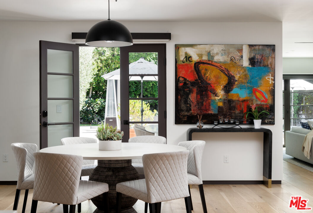 1118 Tower Road Beverly Hills, CA 90210 - Photo 7 of 16 a view of a dining room with furniture window and outside view