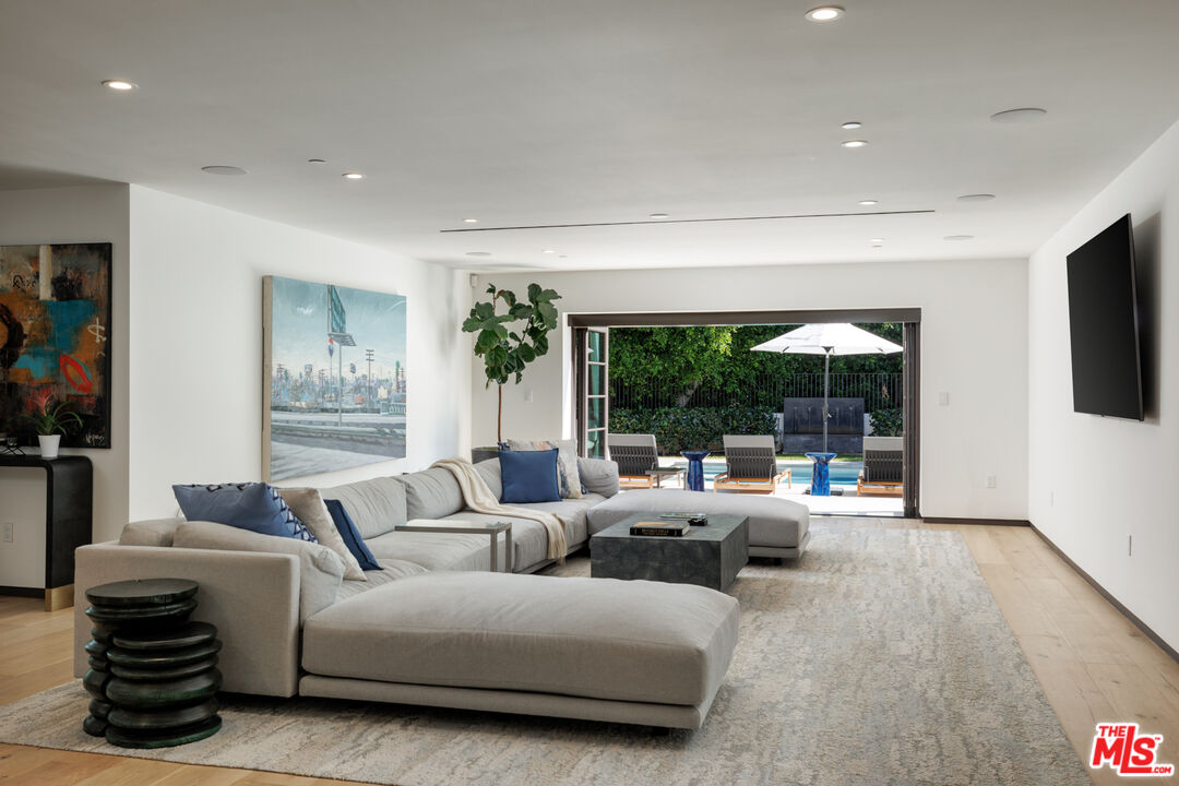 1118 Tower Road Beverly Hills, CA 90210 - Photo 8 of 16 a living room with furniture and a large window