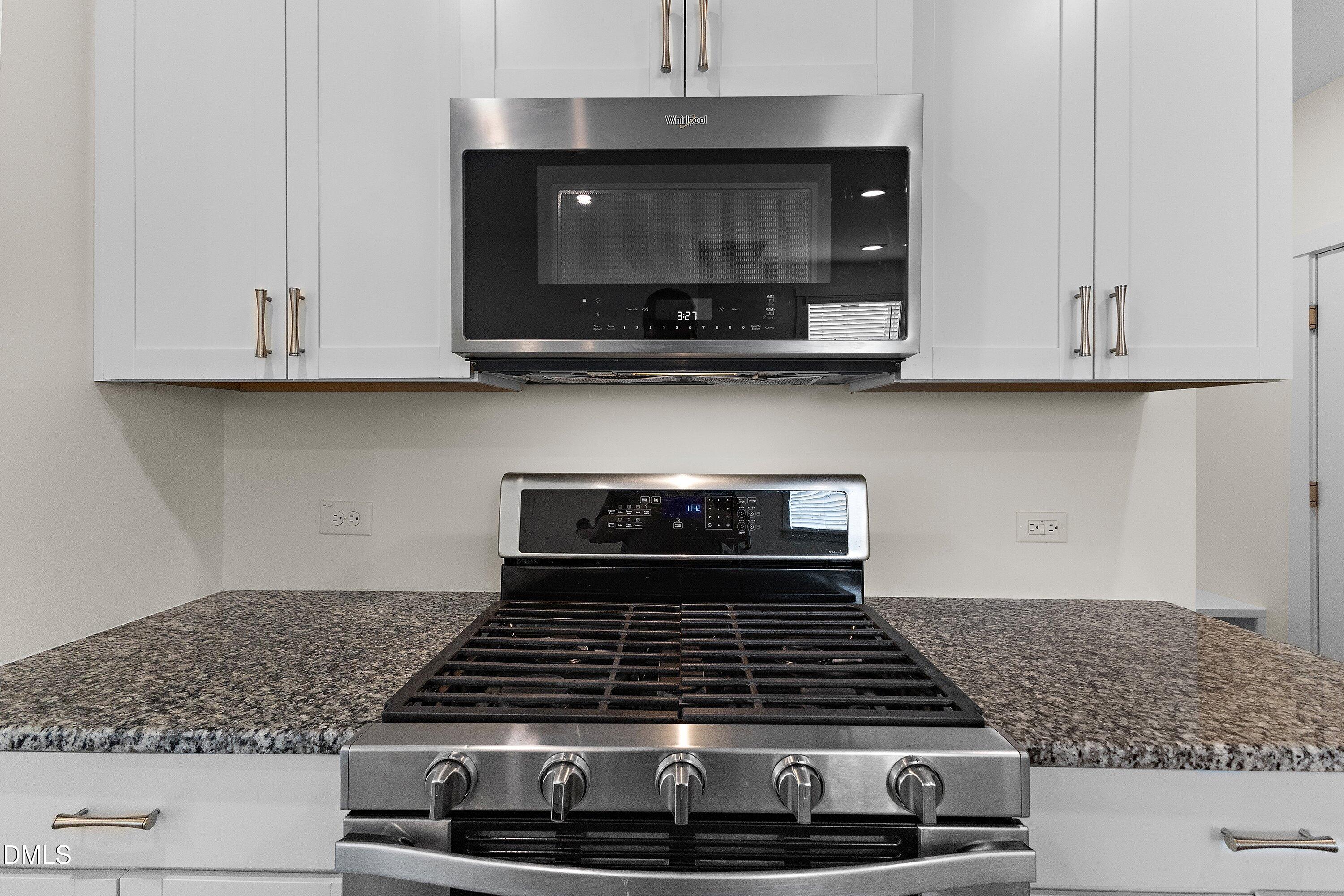 156 Sears Ridge Lane Morrisville, NC 27560 - Photo 8 of 49 a stove top oven sitting inside of a kitchen