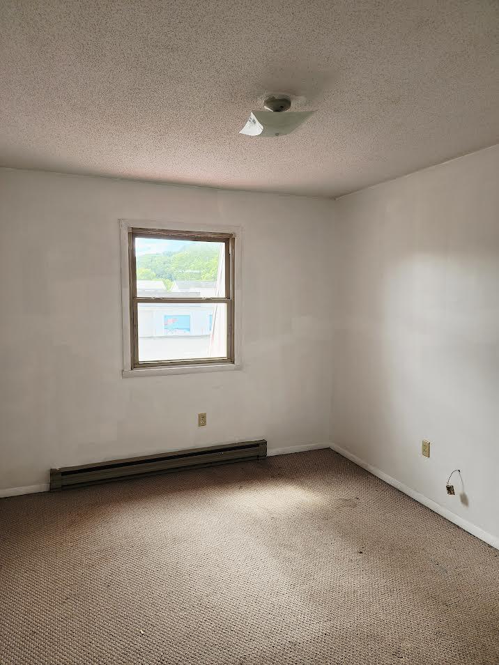 159 Bottom Road, Unit 4 Raven, VA 24639 - Photo 9 of 13 an empty room with a window