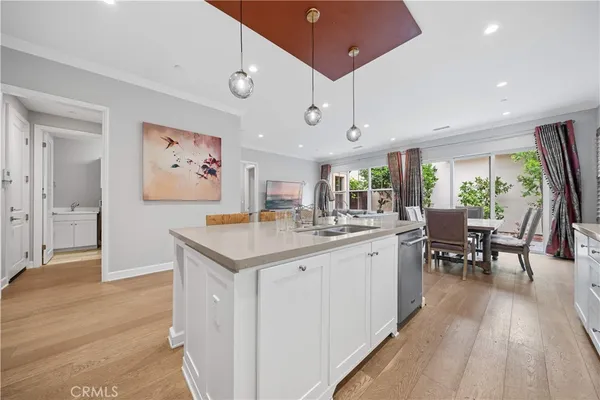 a kitchen with center island and stainless steel appliances