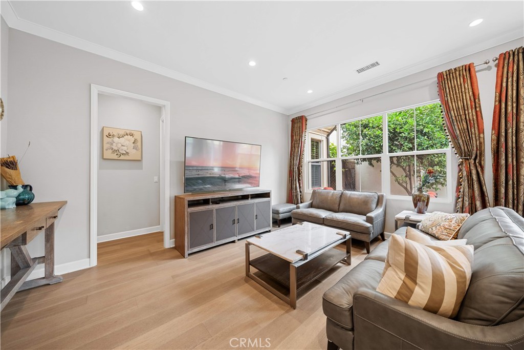 114 Guinness Irvine, CA 92620 - Photo 16 of 43 a living room with furniture flat screen tv and a large window
