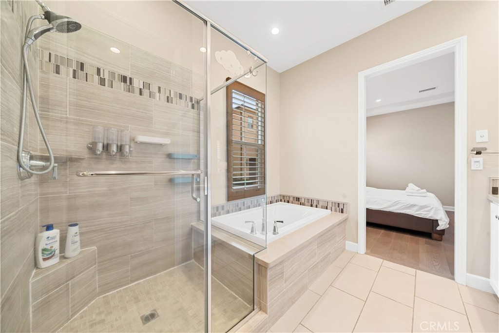 114 Guinness Irvine, CA 92620 - Photo 24 of 43 a bathroom with a bathtub and a shower