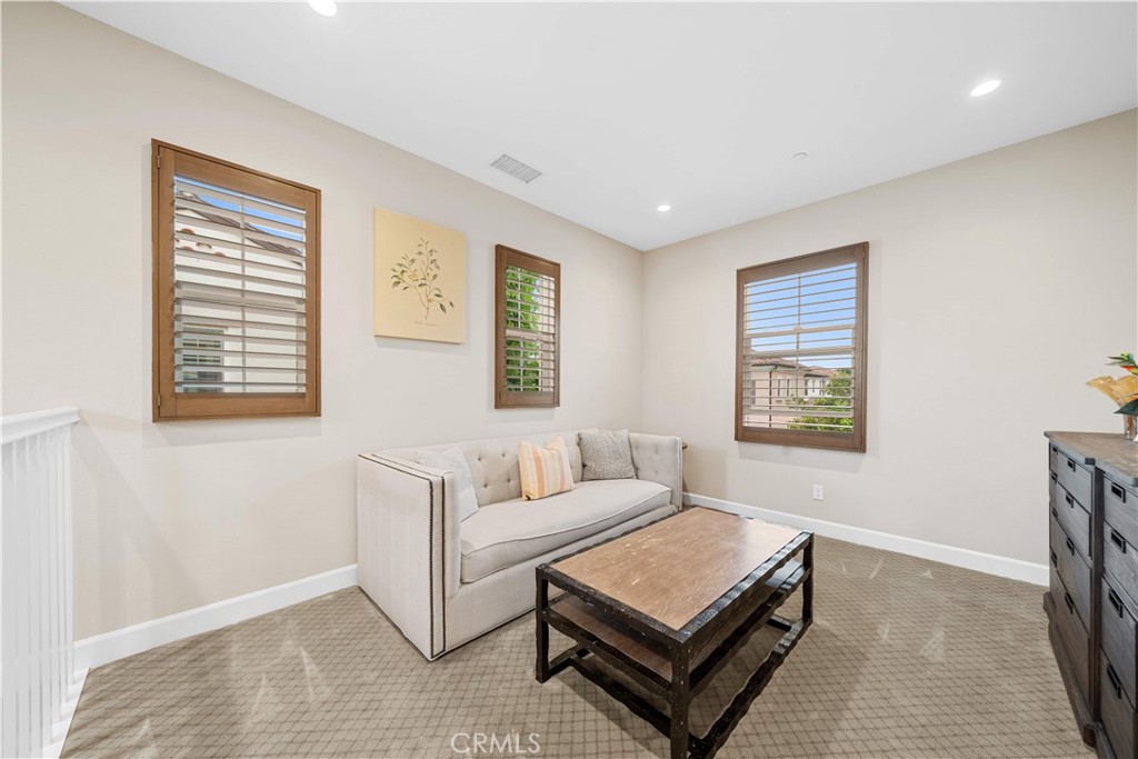 114 Guinness Irvine, CA 92620 - Photo 25 of 43 a living room with furniture and a window