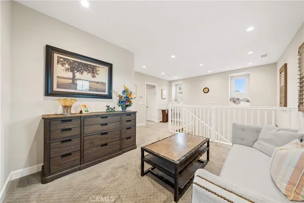 a living room with furniture and a bed