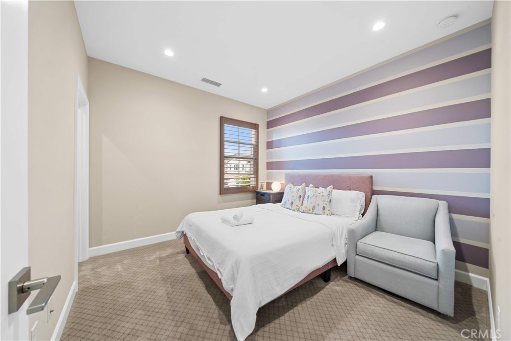 114 Guinness Irvine, CA 92620 - Photo 28 of 43 a bedroom with a large bed and a couch