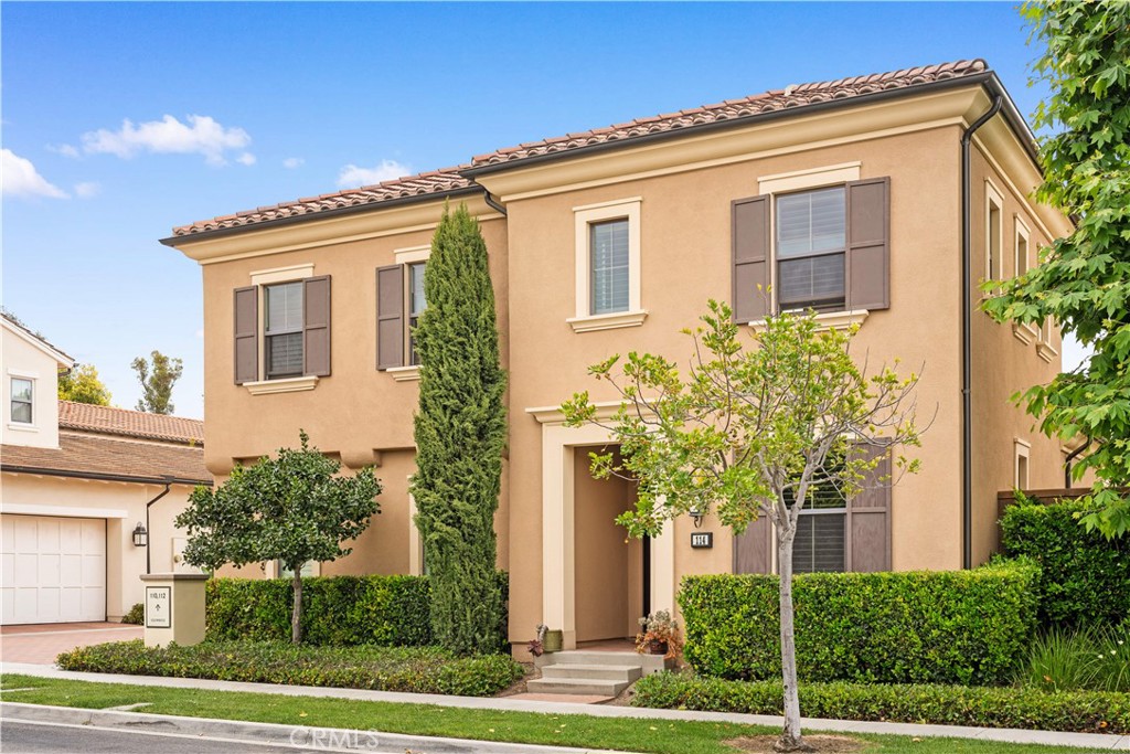 114 Guinness Irvine, CA 92620 - Photo 3 of 43 a front view of a house with a yard