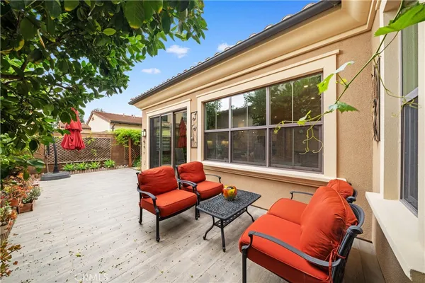 a outdoor living space with patio furniture and a potted plant