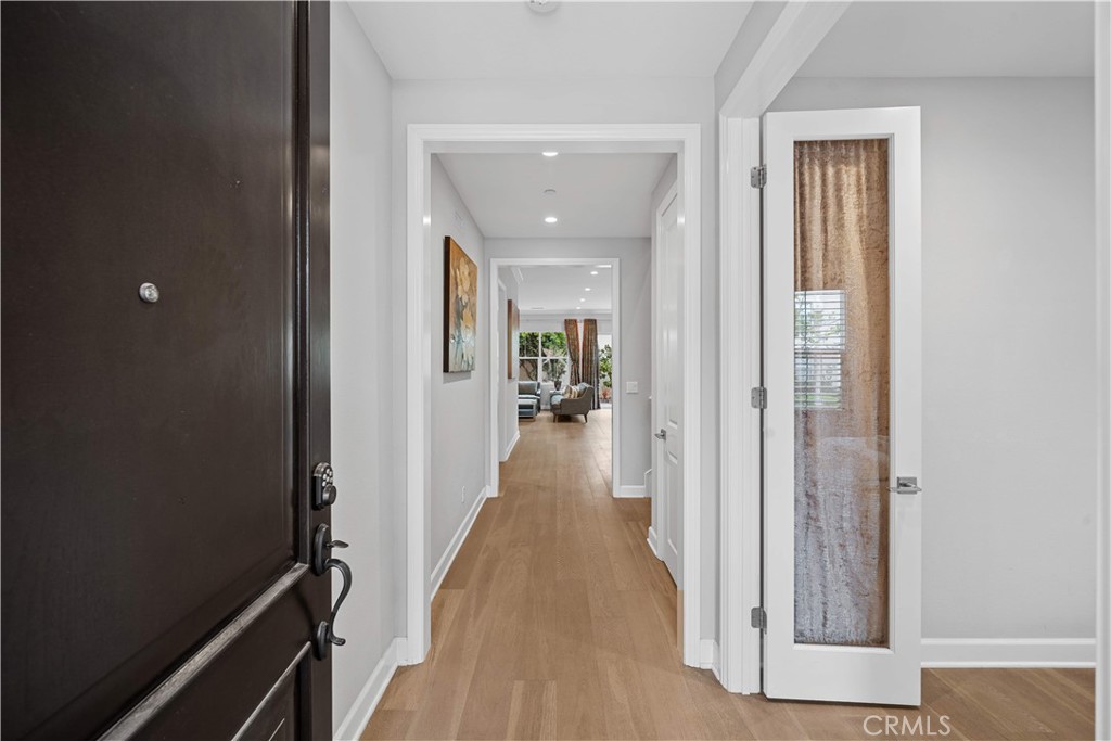 114 Guinness Irvine, CA 92620 - Photo 4 of 43 a view of hallway with wooden floor