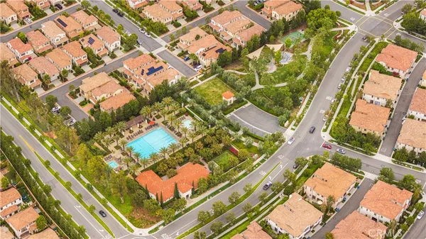 an aerial view of residential houses with yard