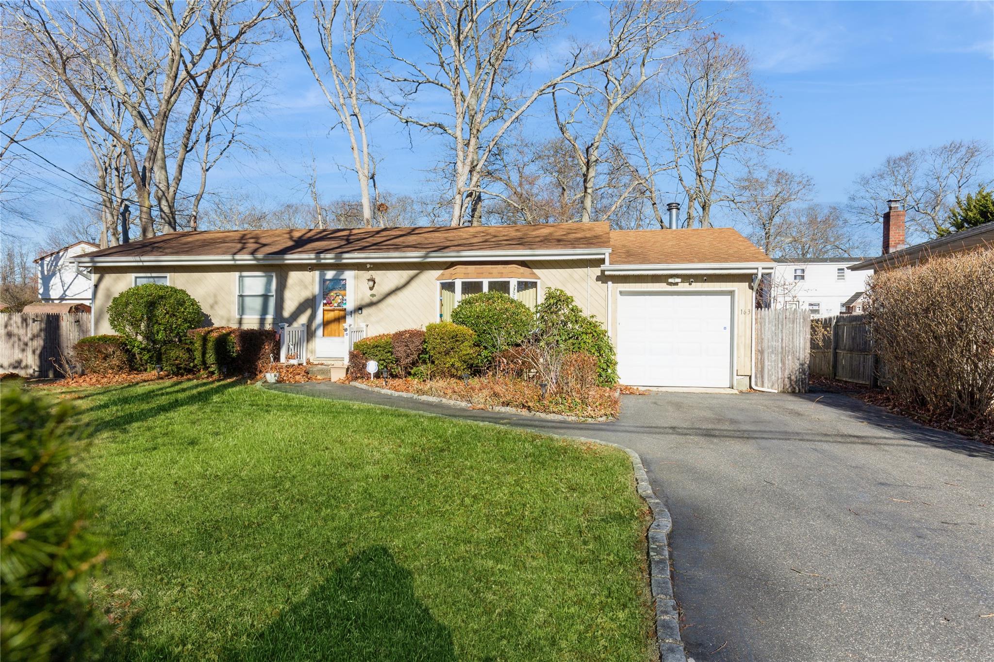 163 Hampton Avenue Mastic, NY 11950 - Photo 1 of 1 Single story home featuring a garage and a front lawn