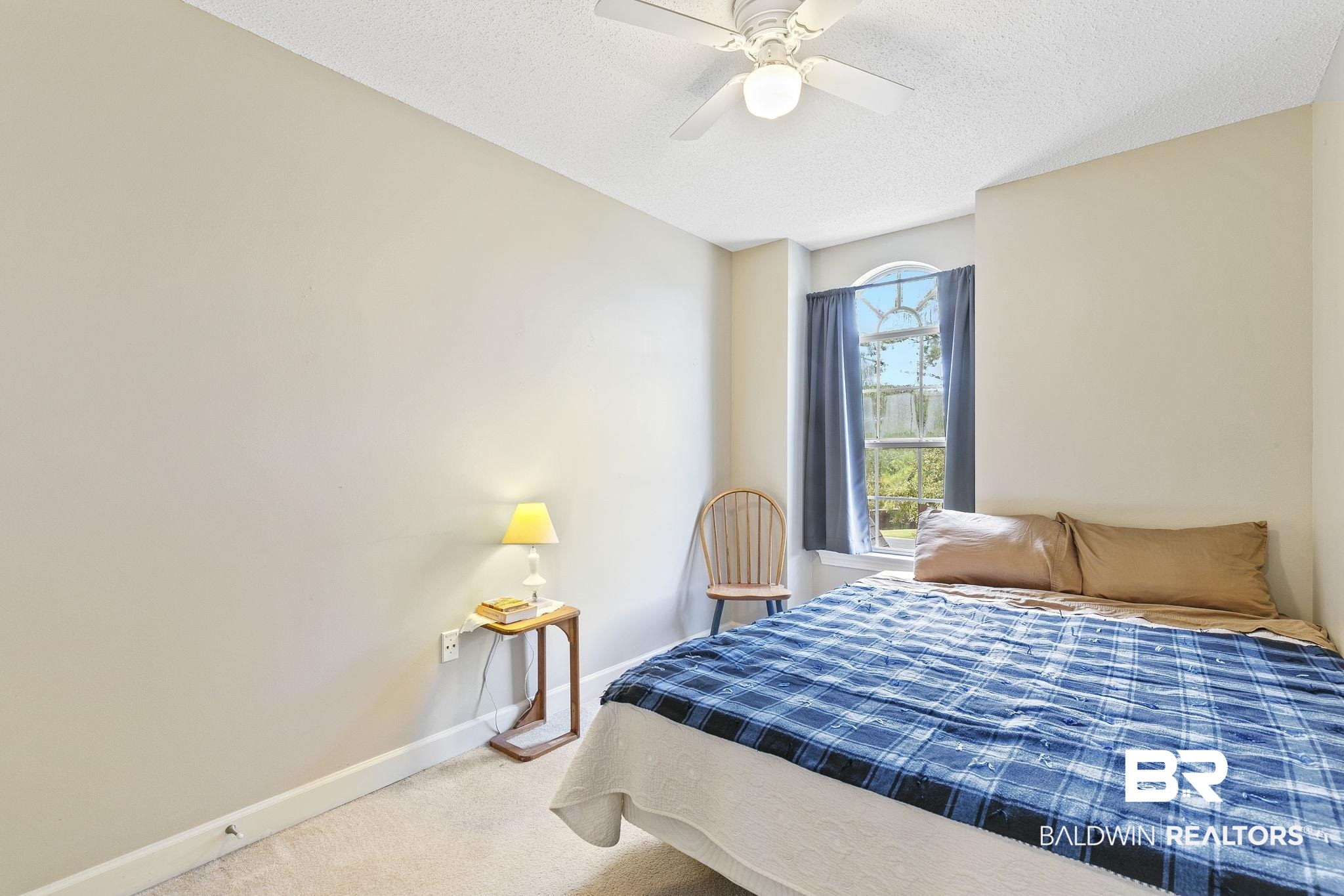 22 Pirates Lane Daphne, AL 36527 - Photo 32 of 36 Carpeted bedroom with ceiling fan and a textured ceiling