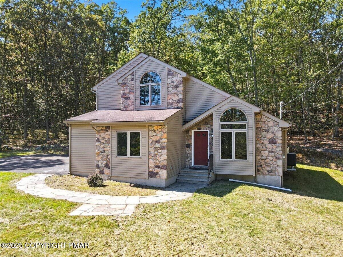 a front view of a house with a yard
