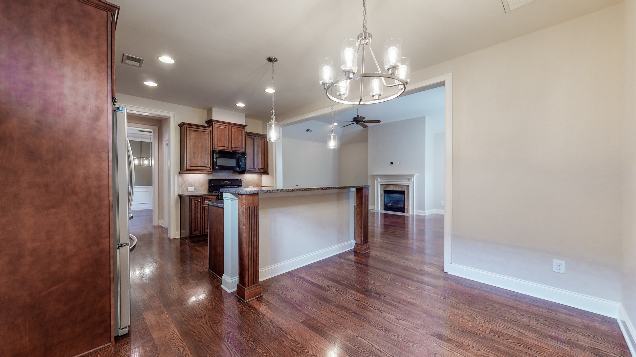 718 Pearre Springs Way Franklin, TN 37064 - Photo 12 of 46 a view of a kitchen with a sink and stainless steel appliances