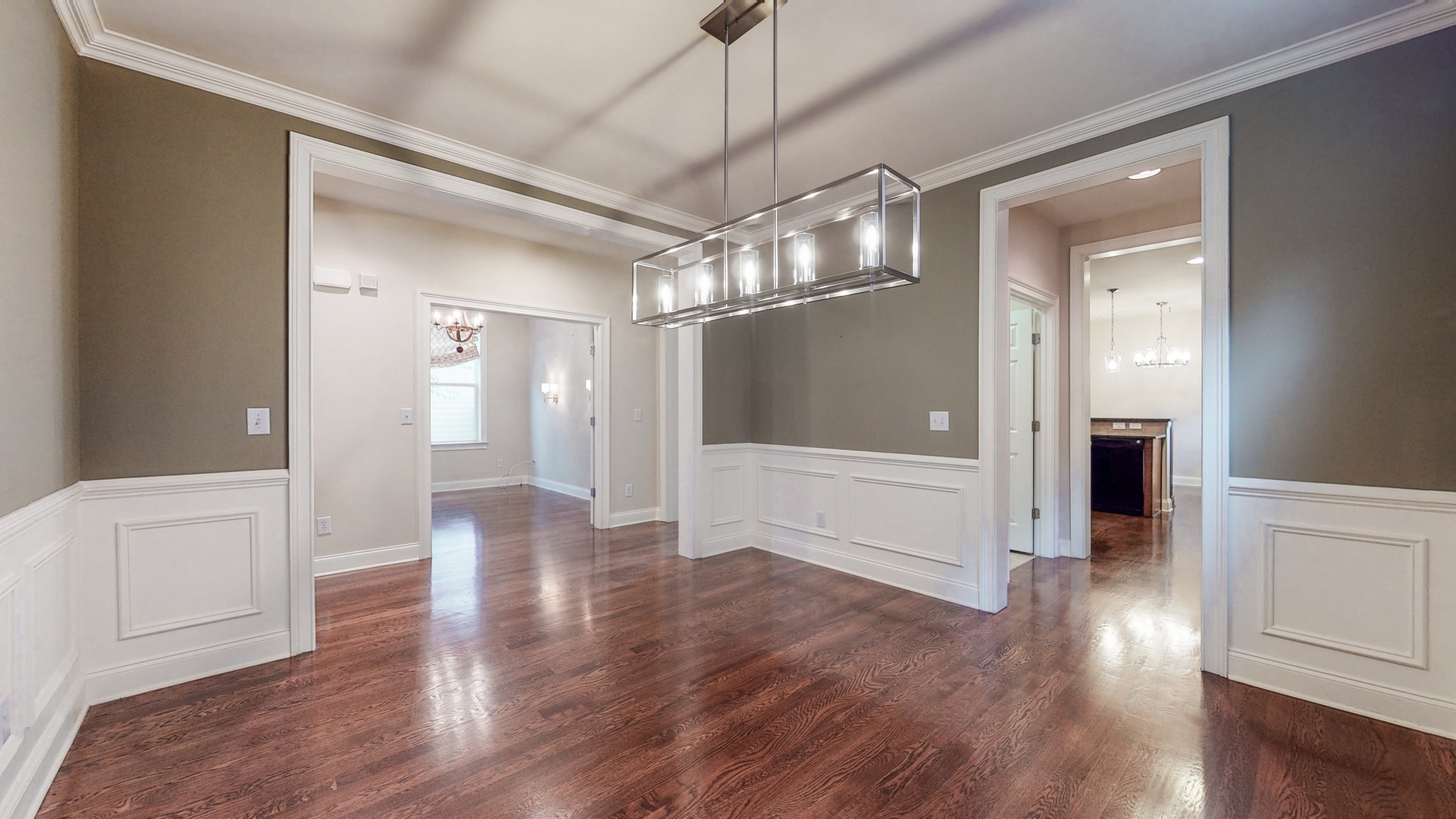 718 Pearre Springs Way Franklin, TN 37064 - Photo 15 of 46 a view of a hallway with wooden floor and chandelier