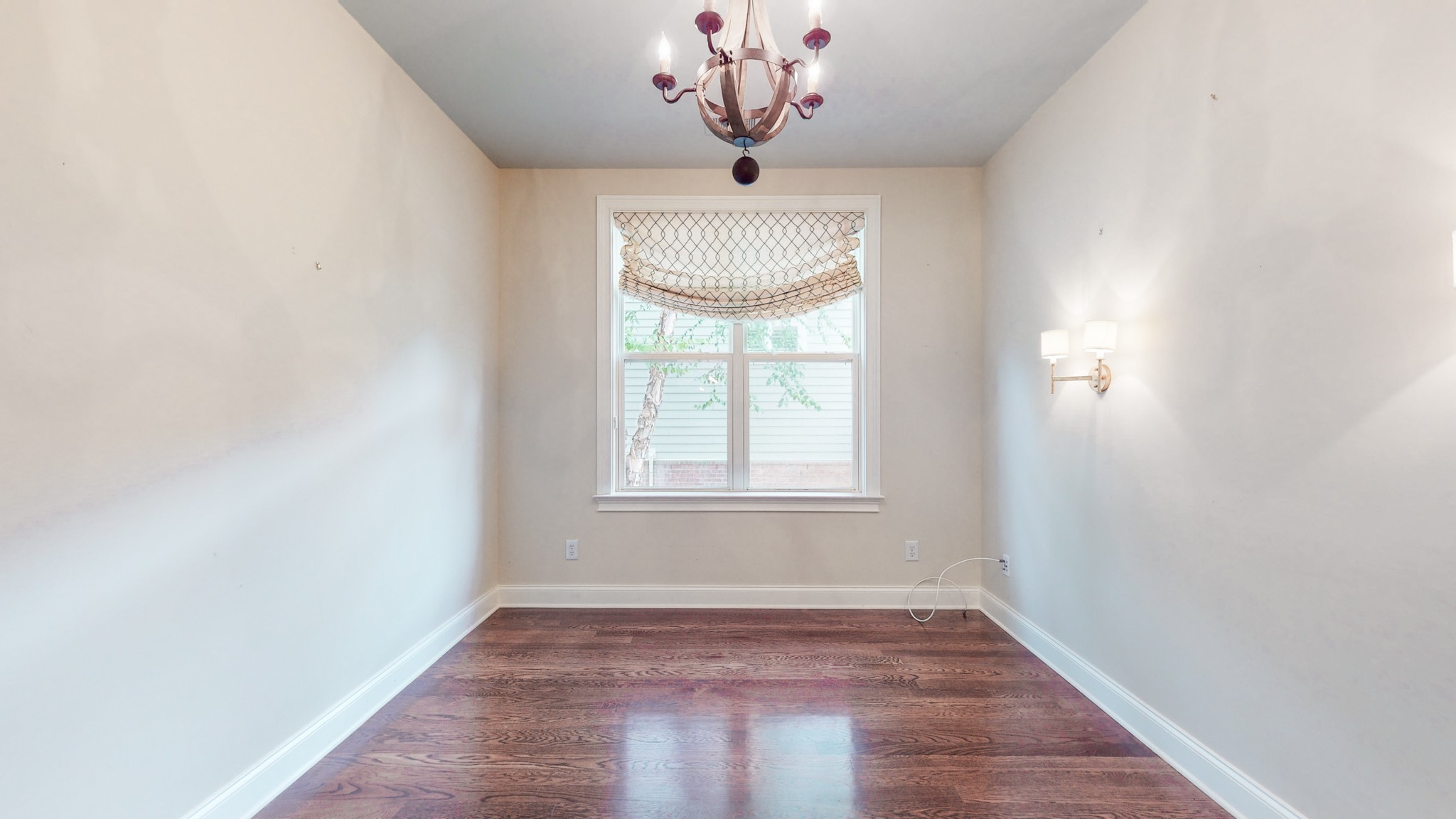 718 Pearre Springs Way Franklin, TN 37064 - Photo 16 of 46 an empty room with a window and a chandelier