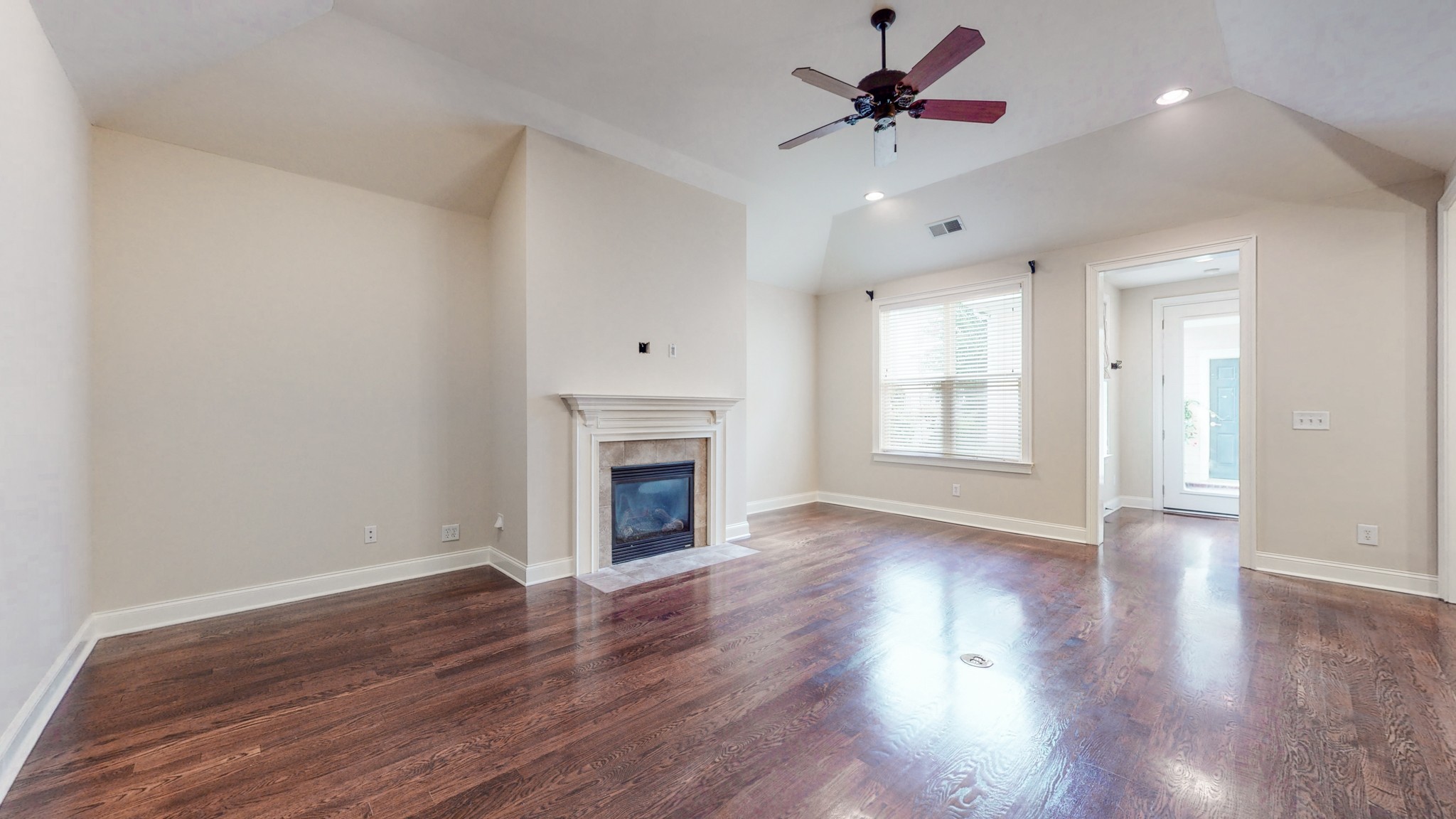 718 Pearre Springs Way Franklin, TN 37064 - Photo 2 of 46 a view of an empty room with window and wooden floor