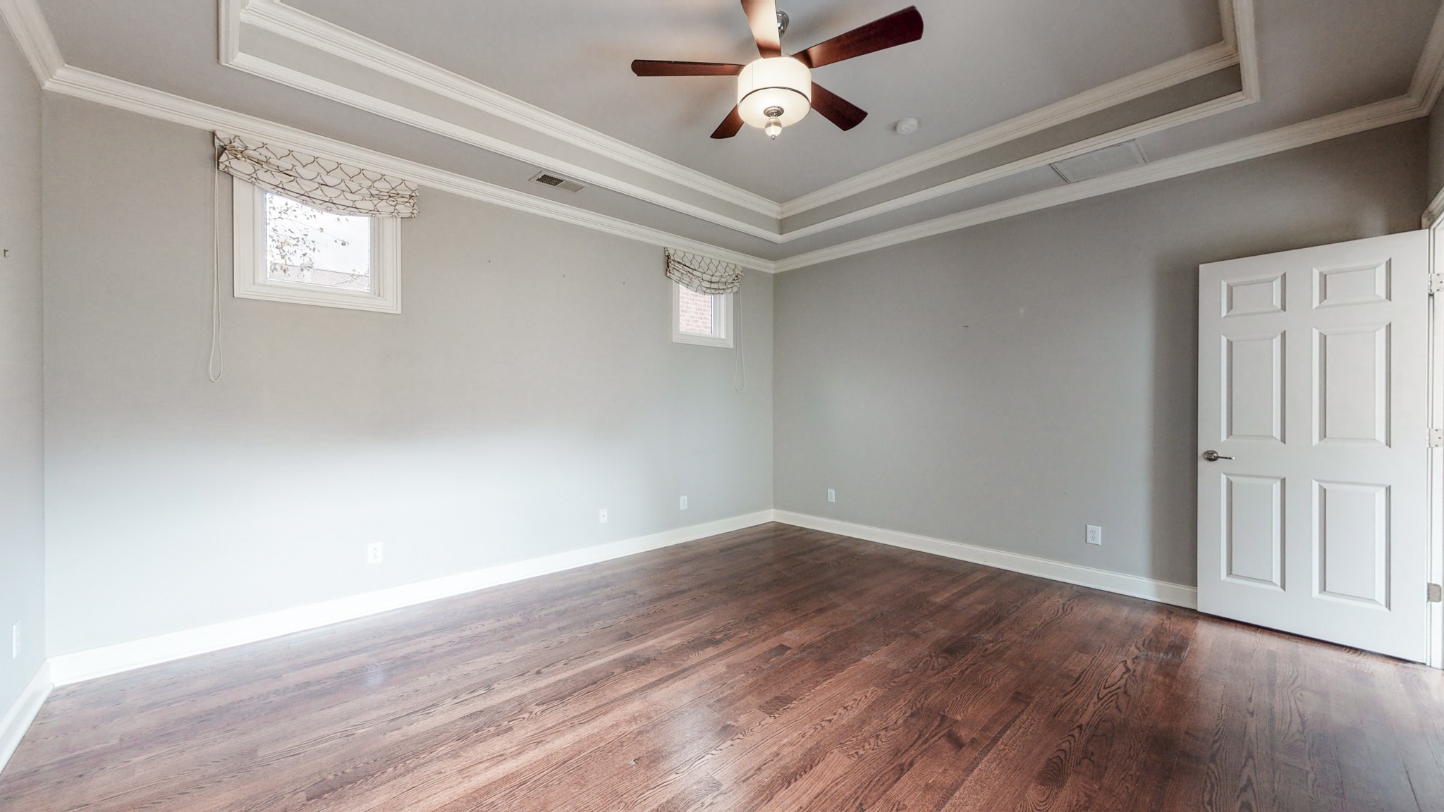 718 Pearre Springs Way Franklin, TN 37064 - Photo 21 of 46 a view of an empty room with wooden floor and a window