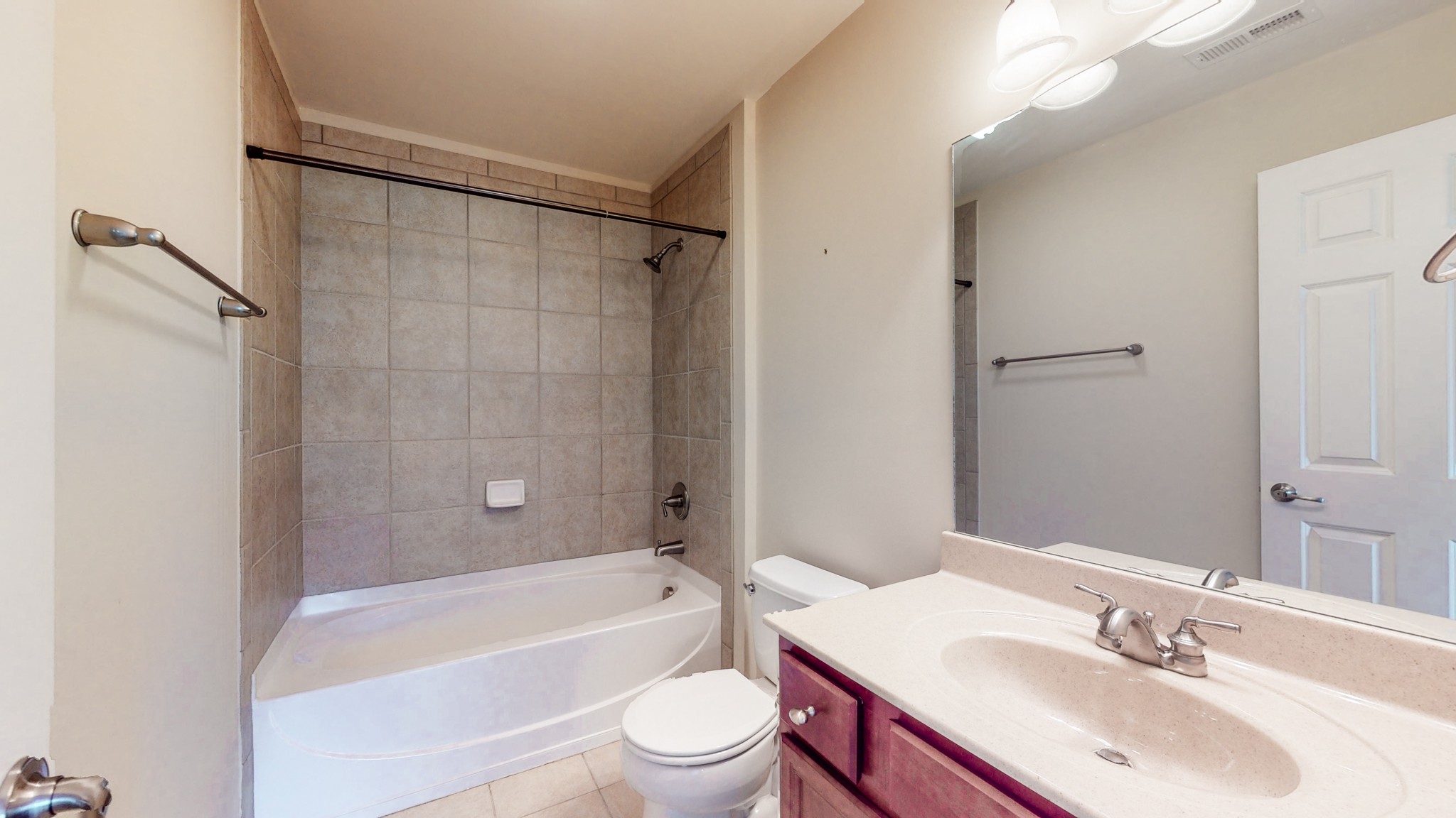 718 Pearre Springs Way Franklin, TN 37064 - Photo 32 of 46 a bathroom with a sink a toilet a mirror a bathtub and shower