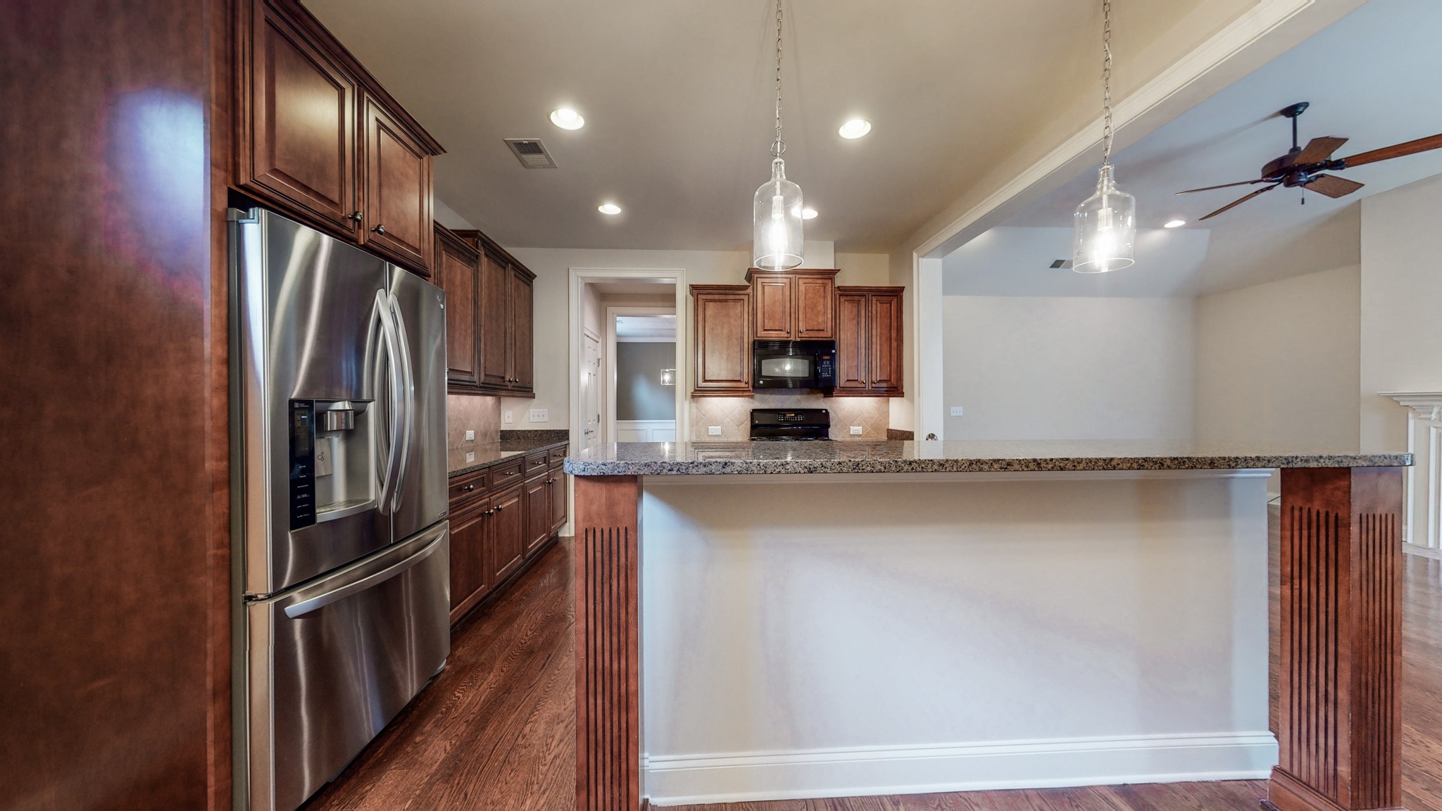 718 Pearre Springs Way Franklin, TN 37064 - Photo 10 of 46 a kitchen with stainless steel appliances a refrigerator and a sink