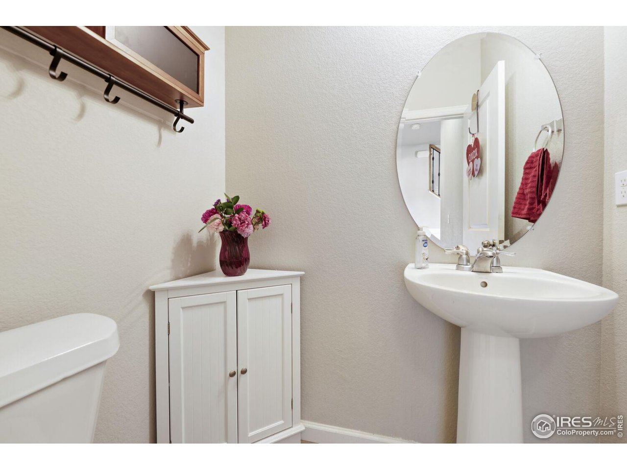6112 Black Mesa Road Frederick, CO 80516 - Photo 13 of 45 a bathroom with a sink and mirror
