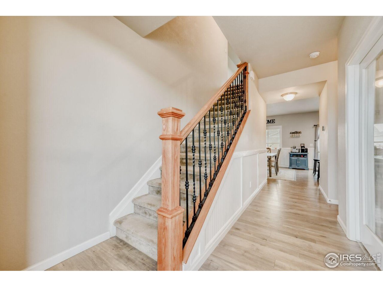 6112 Black Mesa Road Frederick, CO 80516 - Photo 14 of 45 a view of a hallway with wooden floor and staircase