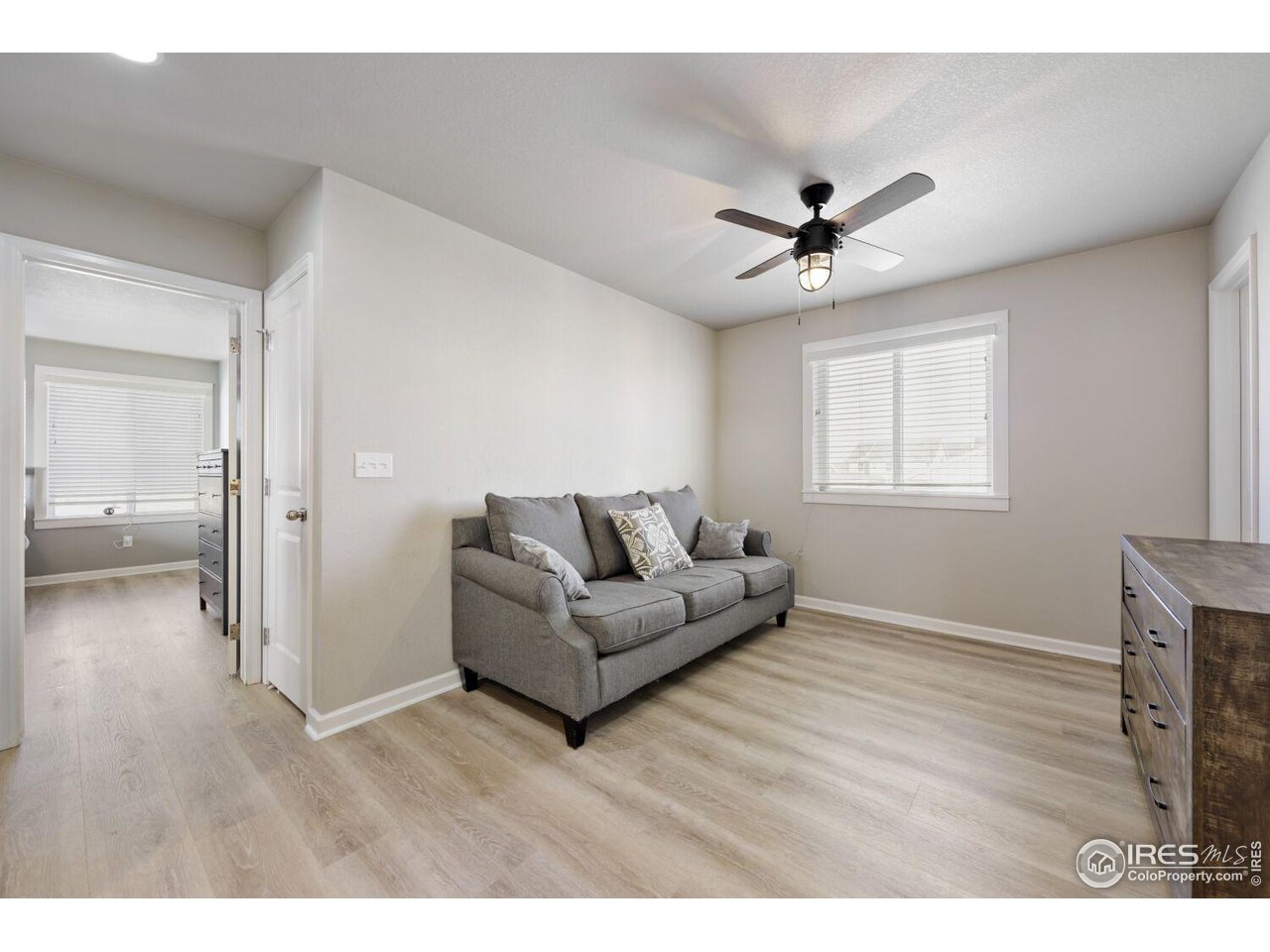 6112 Black Mesa Road Frederick, CO 80516 - Photo 17 of 45 a living room with furniture and a ceiling fan