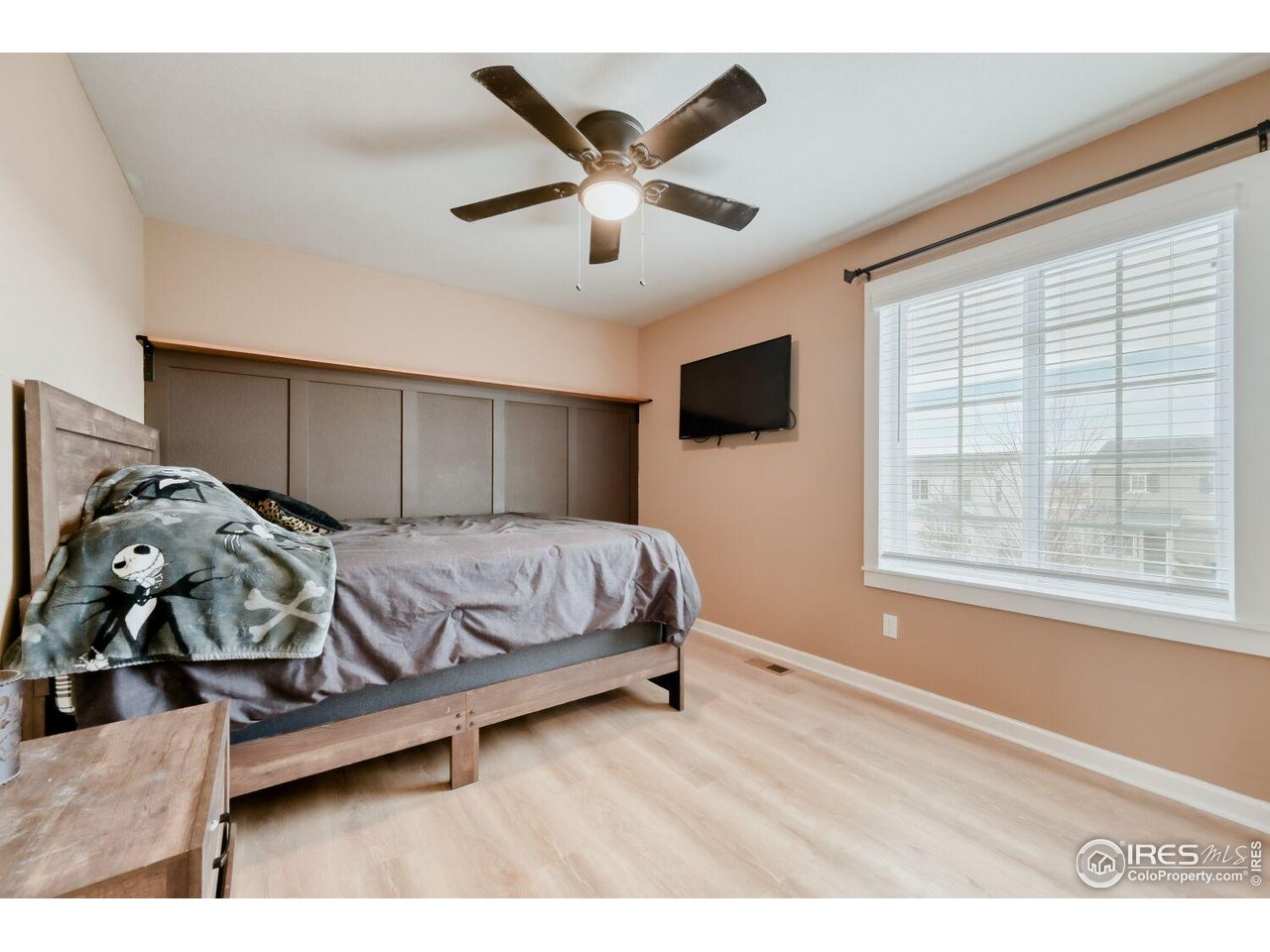 6112 Black Mesa Road Frederick, CO 80516 - Photo 26 of 45 a bedroom with a bed and window