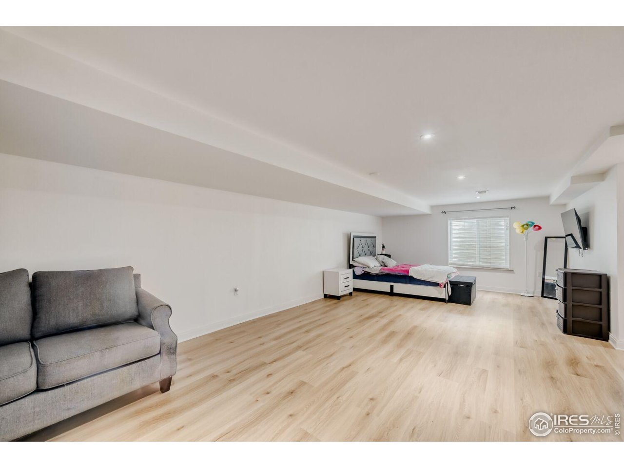 6112 Black Mesa Road Frederick, CO 80516 - Photo 27 of 45 a view of a livingroom with furniture and wooden floor