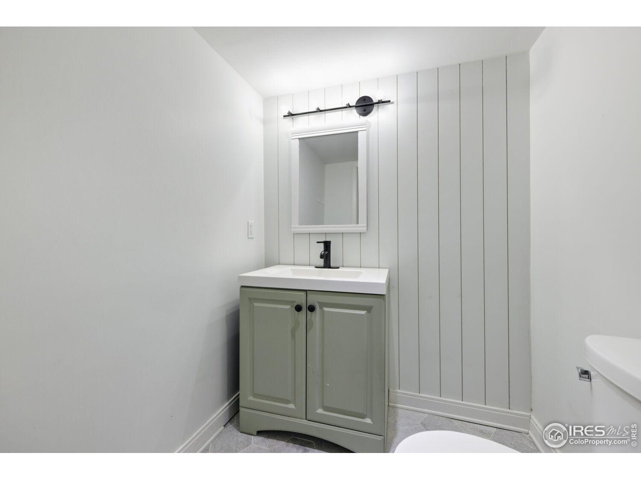6112 Black Mesa Road Frederick, CO 80516 - Photo 32 of 45 a bathroom with a sink a mirror and vanity