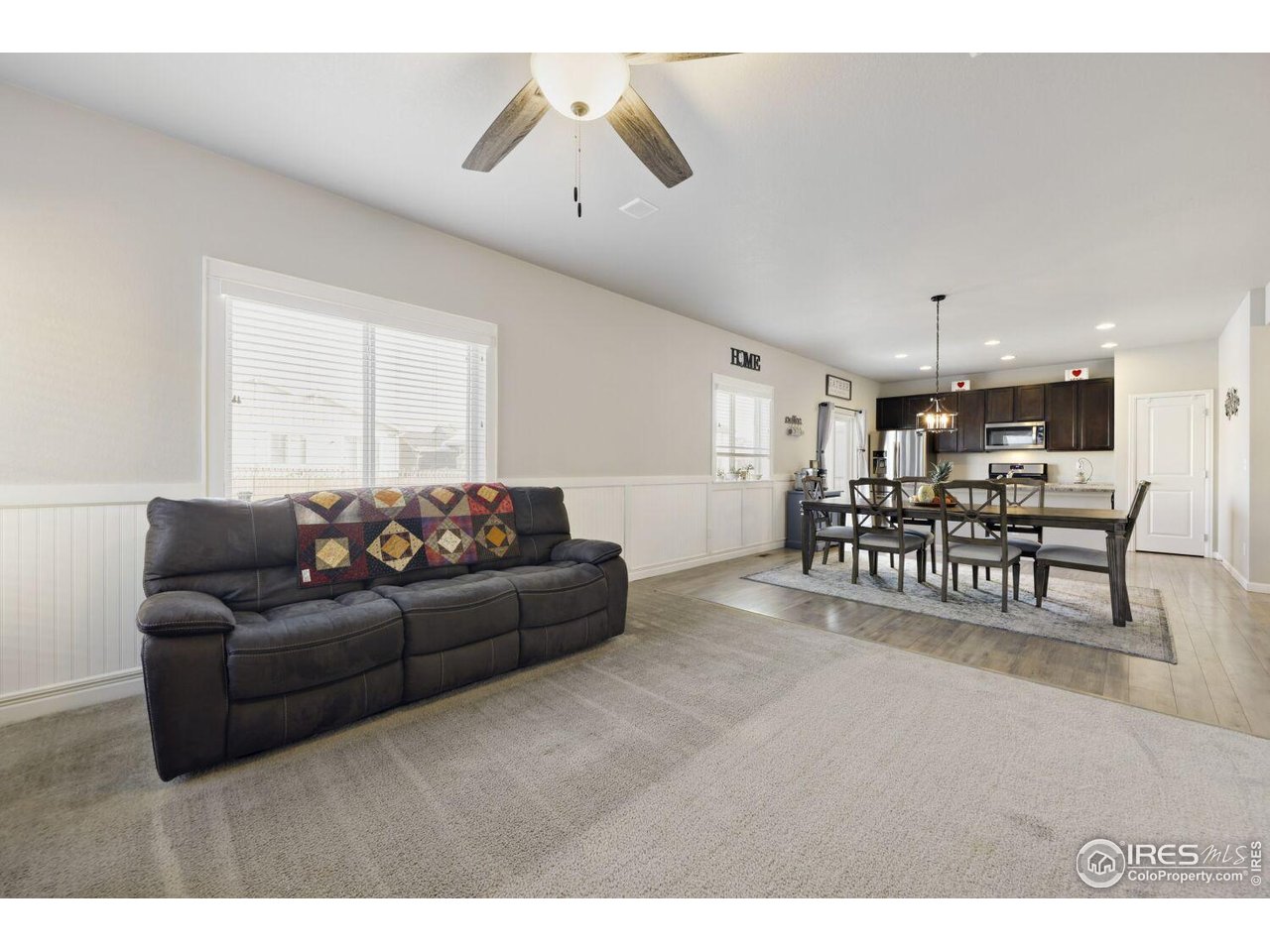 6112 Black Mesa Road Frederick, CO 80516 - Photo 42 of 45 a living room with furniture and kitchen view