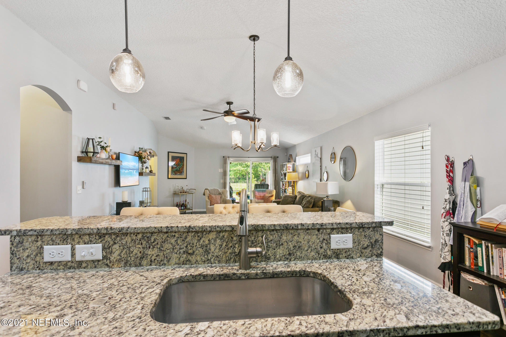 1365 Royal Dornoch Drive Jacksonville, FL 32221 - Photo 11 of 32 a bathroom with a granite countertop sink a mirror and vanity